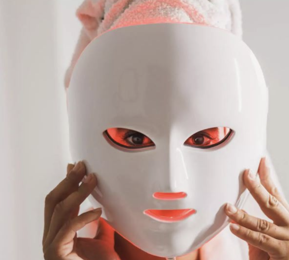 Wearing the LED mask during an at-home treatment